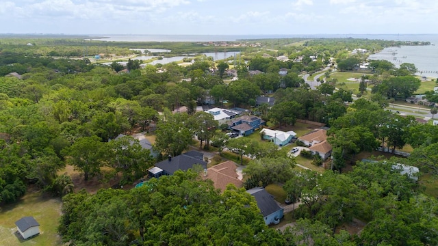view of property location featuring a nearby body of water and nearby suburban area