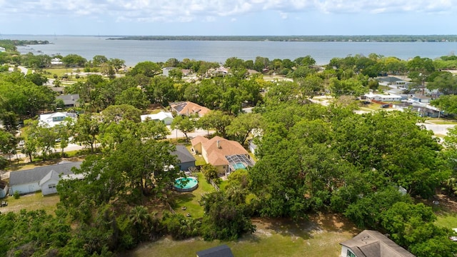 aerial perspective of suburban area with a nearby body of water