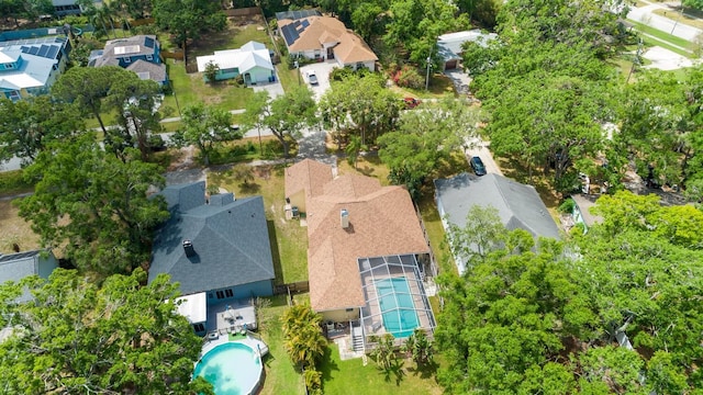 view of property location featuring a pool area and nearby suburban area
