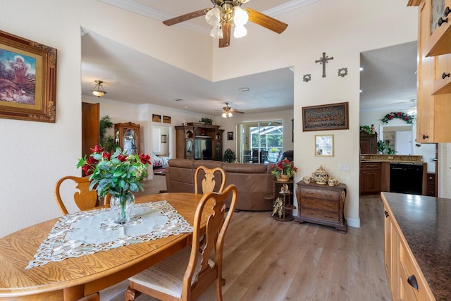 dining area featuring a ceiling fan, crown molding, and light wood-type flooring