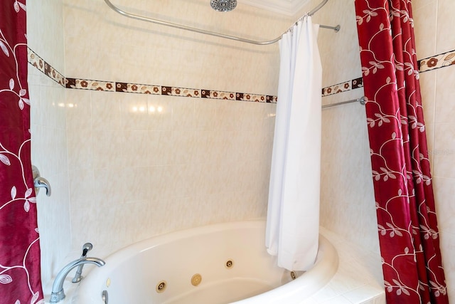 bathroom with a combined bath / shower with jetted tub