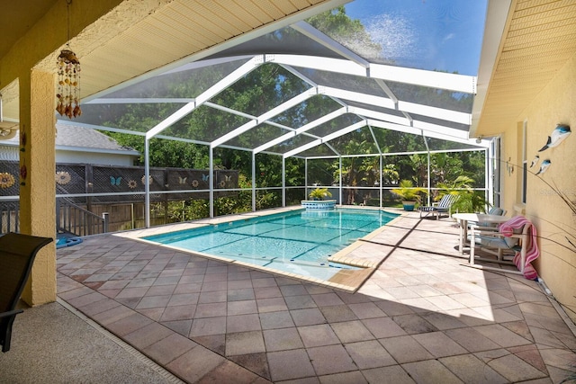 view of pool featuring a patio area and a lanai