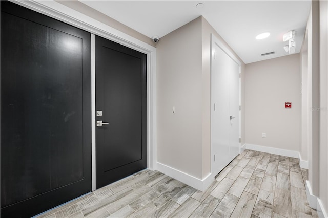 19816 Gulf Blvd Unit 602, Indian Shores, FL 33785 - entryway featuring light wood-style floors, visible vents, and baseboards