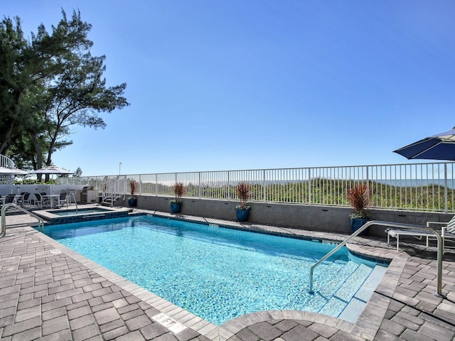19816 Gulf Blvd Unit 602, Indian Shores, FL 33785 - view of swimming pool with a patio area, a fenced in pool, an in ground hot tub, and fence
