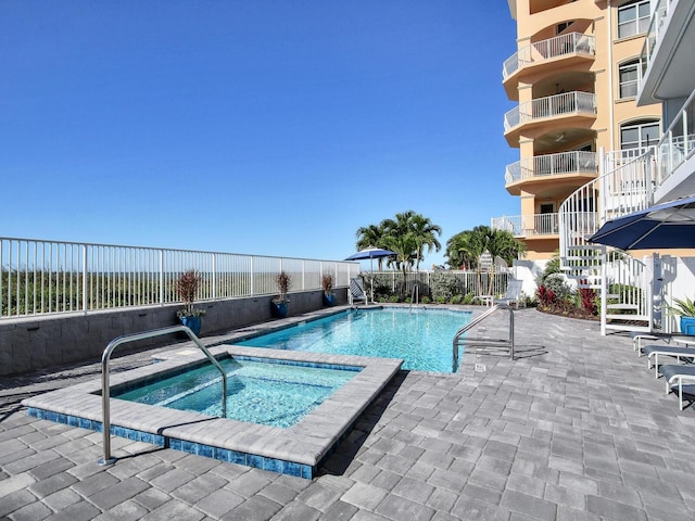 19816 Gulf Blvd Unit 602, Indian Shores, FL 33785 - community pool featuring a community hot tub, a patio, a fenced backyard, and stairway