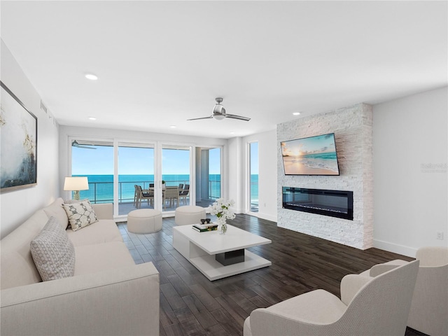 19816 Gulf Blvd Unit 602, Indian Shores, FL 33785 - living area with dark wood finished floors, recessed lighting, a fireplace, and ceiling fan