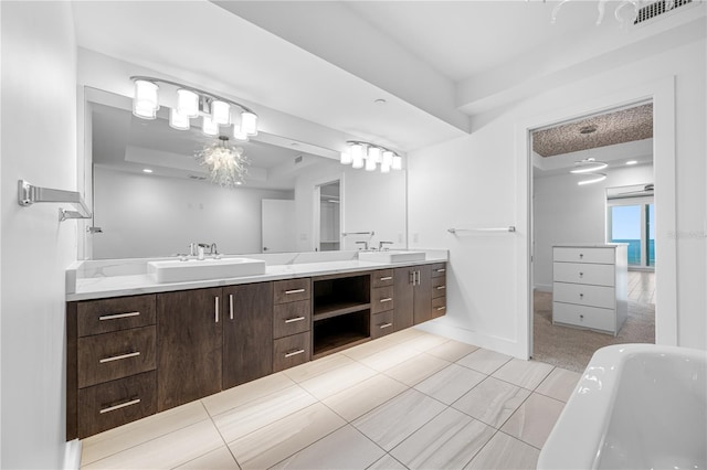 19816 Gulf Blvd Unit 602, Indian Shores, FL 33785 - full bath featuring double vanity, a soaking tub, and tile patterned floors