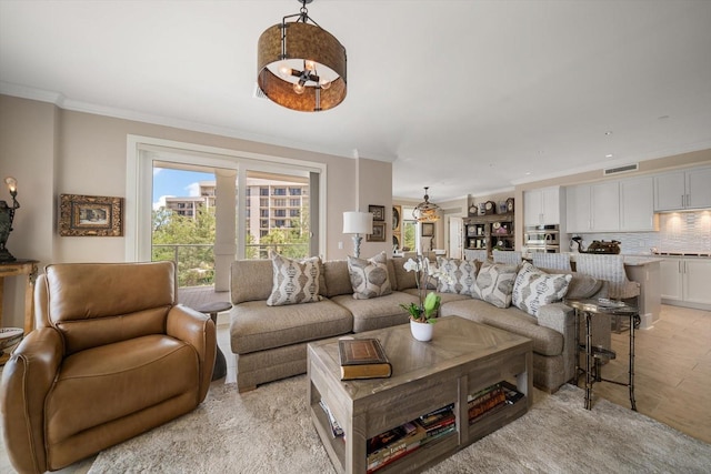 145 Belleview Blvd Unit 201, Belleair, FL 33756 - living room featuring crown molding and visible vents
