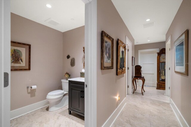 145 Belleview Blvd Unit 201, Belleair, FL 33756 - bathroom with vanity, baseboards, recessed lighting, toilet, and visible vents