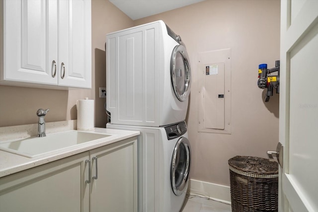 145 Belleview Blvd Unit 201, Belleair, FL 33756 - laundry room with electric panel, a sink, cabinet space, and stacked washer / drying machine