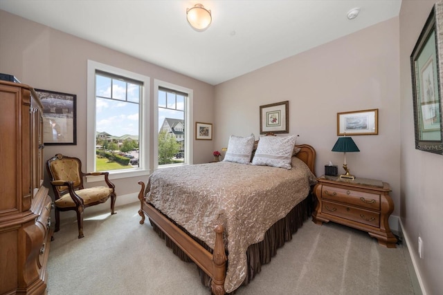 145 Belleview Blvd Unit 201, Belleair, FL 33756 - bedroom with baseboards and light colored carpet