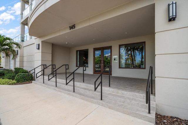 145 Belleview Blvd Unit 201, Belleair, FL 33756 - view of exterior entry with french doors and stucco siding