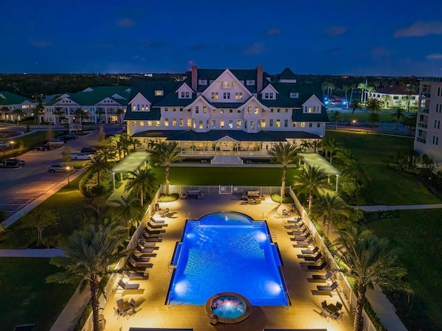 145 Belleview Blvd Unit 201, Belleair, FL 33756 - pool at twilight featuring a patio area and a community pool
