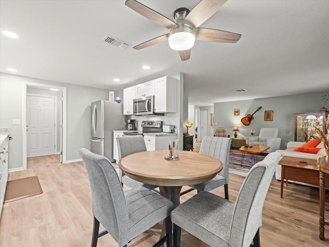 16116 Manorwood Cir, Tampa, FL 33624 - dining room featuring visible vents, recessed lighting, a ceiling fan, and light wood-style floors