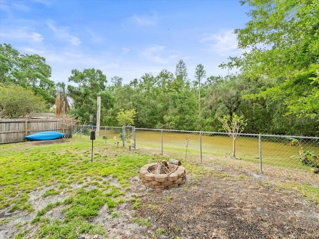 16116 Manorwood Cir, Tampa, FL 33624 - view of yard with fence and a fire pit