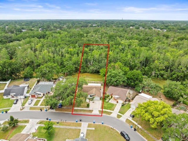 16116 Manorwood Cir, Tampa, FL 33624 - drone / aerial view with a wooded view and a residential view