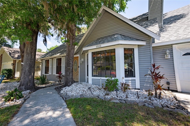 1916 River Crossing Dr, Valrico, FL 33596 - view of front of house featuring a chimney
