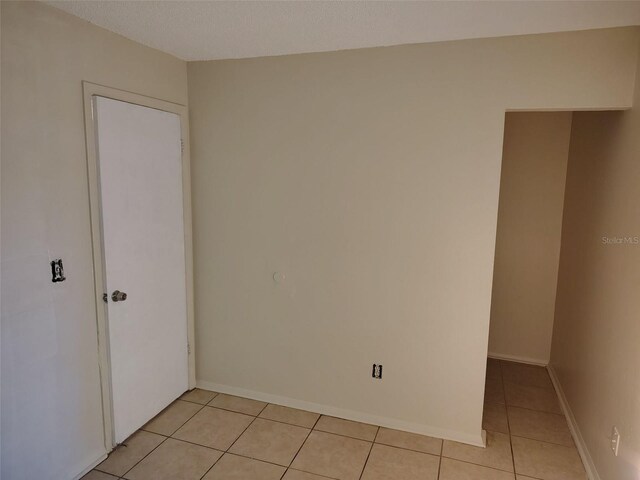 2810 Anthony St, Tampa, FL 33619 - spare room featuring baseboards and light tile patterned flooring