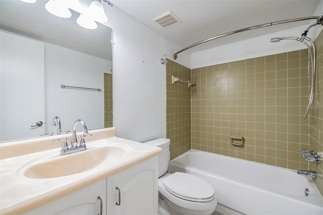 full bathroom with visible vents, shower / bathtub combination, toilet, and vanity