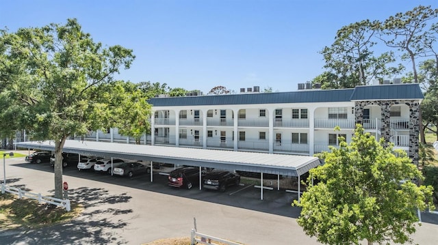 view of property featuring covered parking