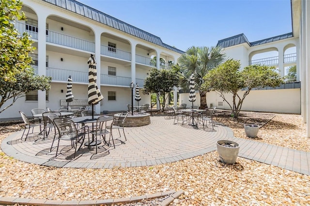 surrounding community with a patio area
