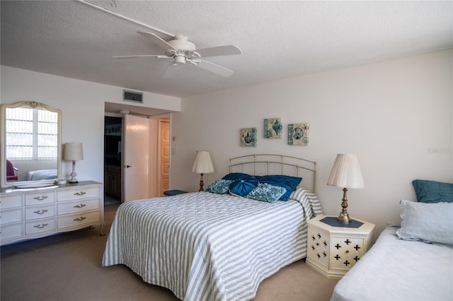 2630 Pearce Dr Unit 104, Clearwater, FL 33764 - bedroom featuring visible vents, a textured ceiling, and carpet floors