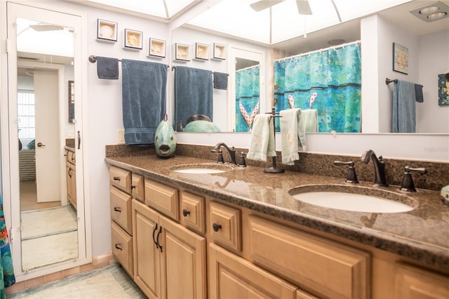 2630 Pearce Dr Unit 104, Clearwater, FL 33764 - full bath featuring a sink, double vanity, and a ceiling fan