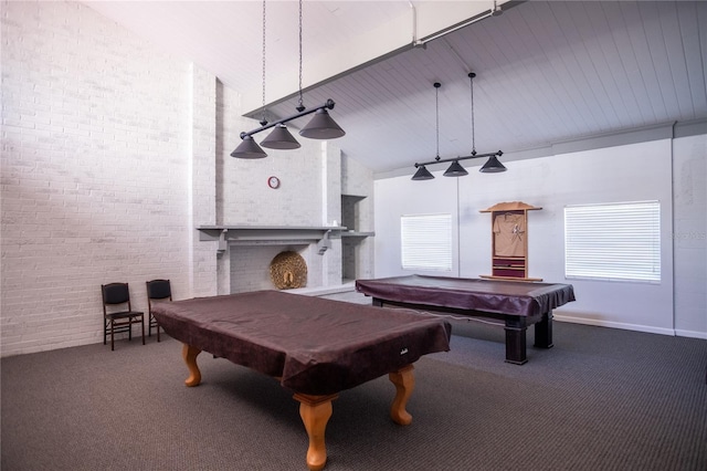 2630 Pearce Dr Unit 104, Clearwater, FL 33764 - playroom featuring pool table, brick wall, a fireplace, carpet flooring, and high vaulted ceiling