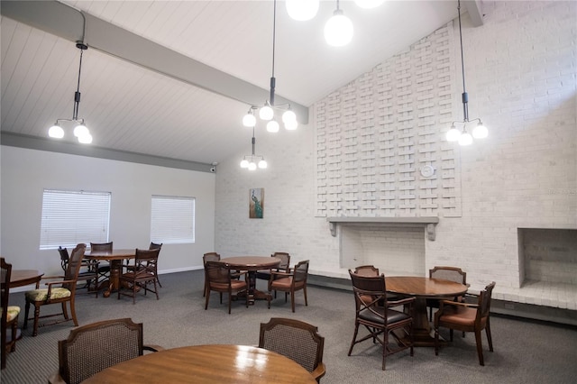 2630 Pearce Dr Unit 104, Clearwater, FL 33764 - carpeted dining area with beamed ceiling, high vaulted ceiling, and a brick fireplace