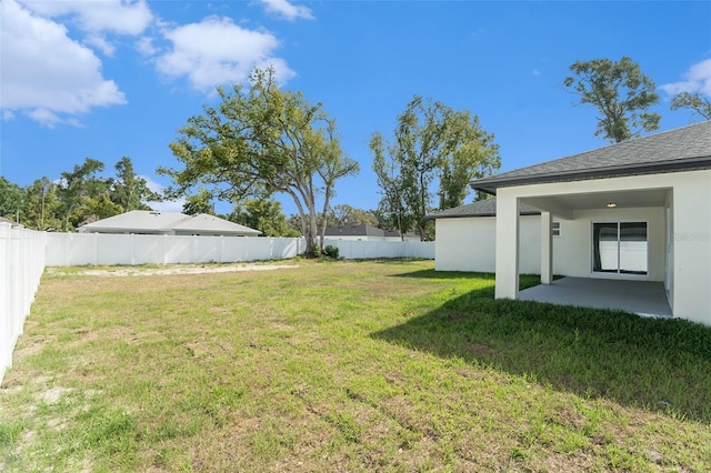 view of yard with a fenced backyard and a patio area