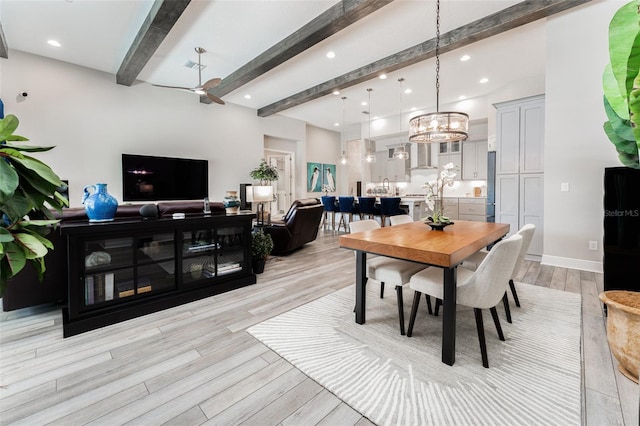 dining space featuring light wood-type flooring, visible vents, recessed lighting, a chandelier, and beamed ceiling