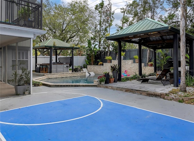 view of sport court with basketball court, a gazebo, a fenced in pool, and a fenced backyard