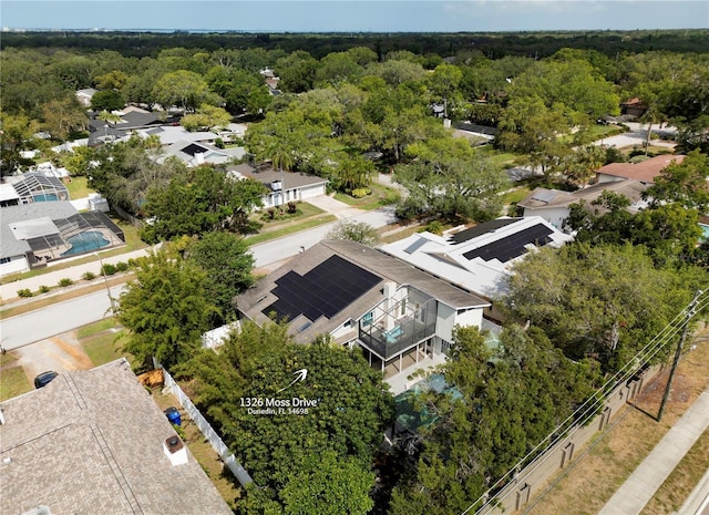 bird's eye view featuring a forest view and a residential view