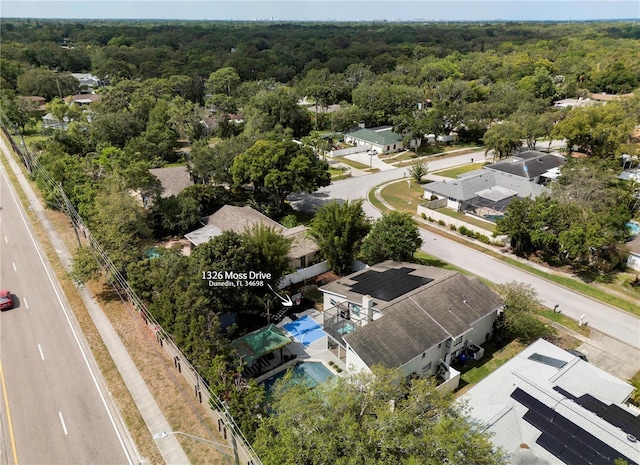aerial view with a residential view and a view of trees