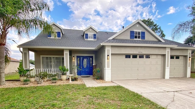 view of front of home featuring a porch, a garage, stucco siding, and a shingled roof