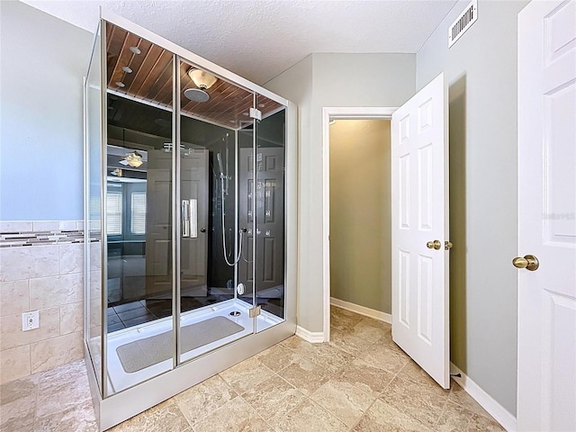 bathroom with baseboards and visible vents