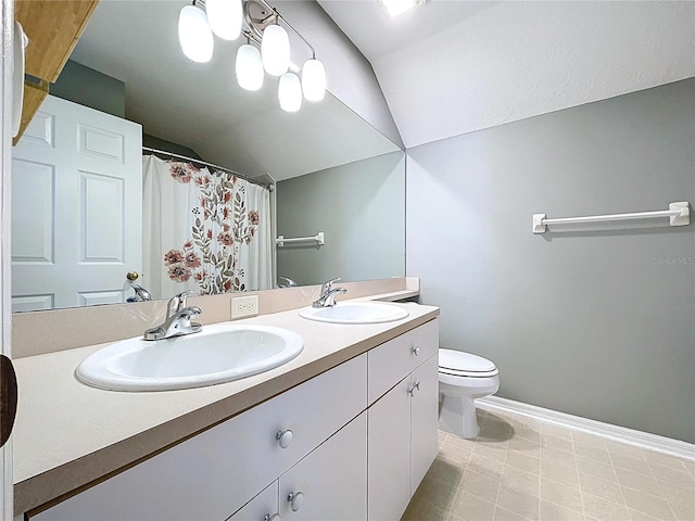 bathroom with lofted ceiling, toilet, baseboards, and a sink