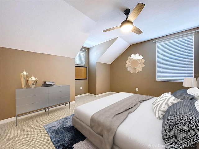 bedroom featuring carpet, ceiling fan, vaulted ceiling, and baseboards