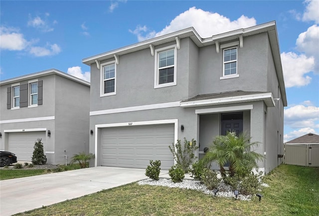 traditional home with a garage, stucco siding, and concrete driveway