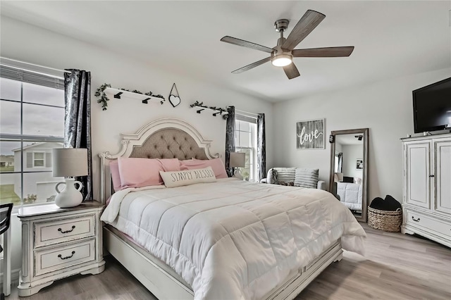 bedroom featuring a ceiling fan and wood finished floors