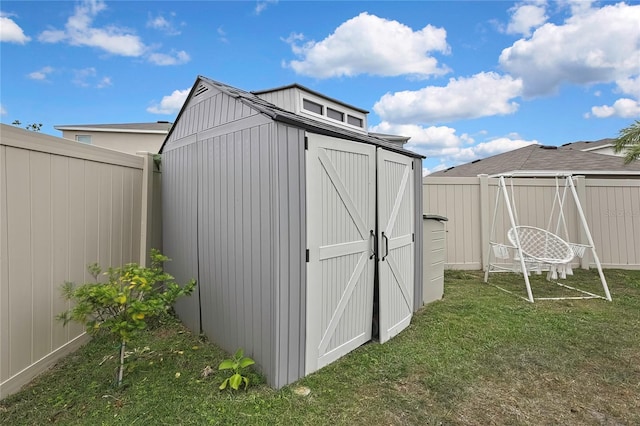 view of shed featuring a fenced backyard
