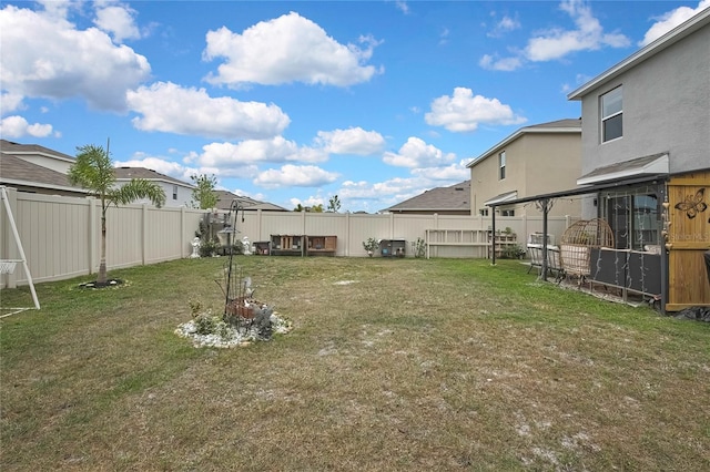 view of yard with a residential view and a fenced backyard