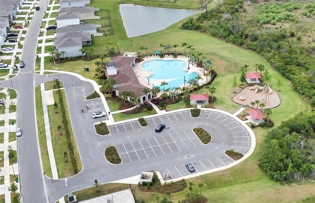 birds eye view of property featuring a water view
