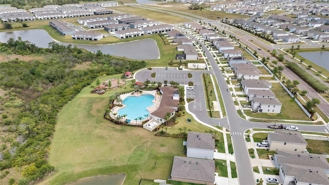 birds eye view of property featuring a residential view and a water view