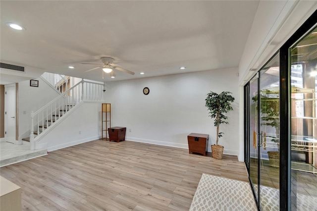 interior space featuring visible vents, ceiling fan, recessed lighting, stairs, and light wood-style flooring