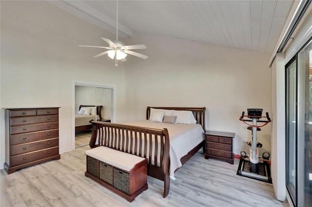 bedroom with ensuite bathroom, light wood-style flooring, ceiling fan, and lofted ceiling with beams