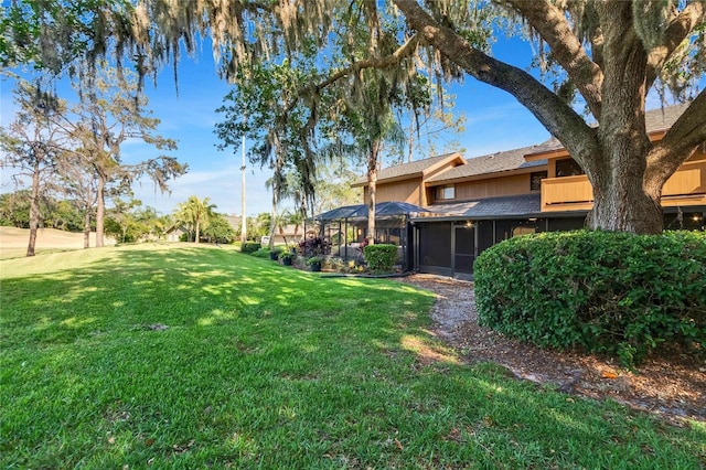 view of yard with a sunroom