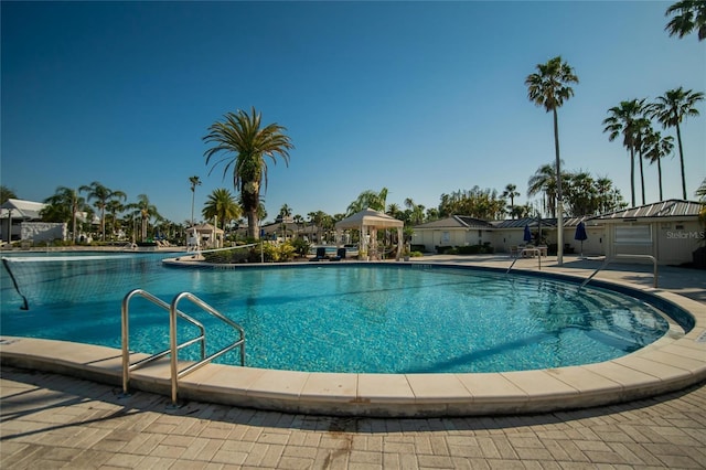 pool featuring a gazebo and a patio