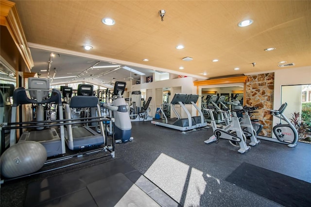 exercise room with recessed lighting and lofted ceiling