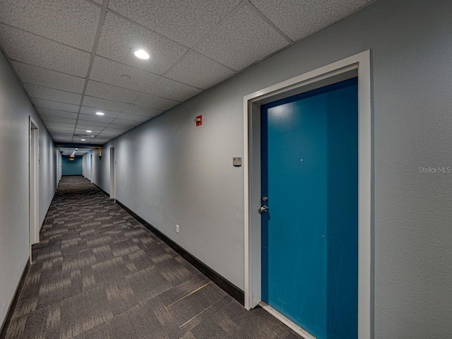 1208 E Kennedy Blvd Unit 1125, Tampa, FL 33602 - hallway featuring dark carpet, recessed lighting, and a drop ceiling